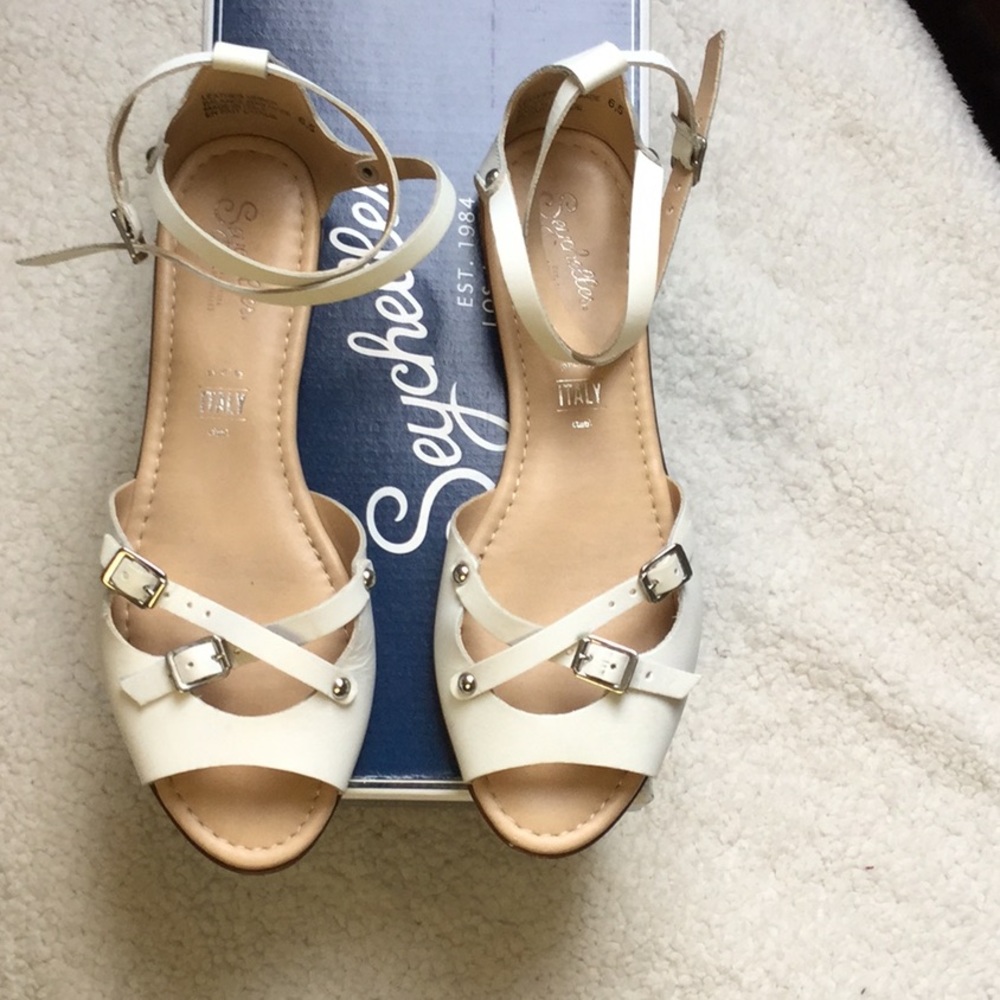 White flat Seychelles sandals.